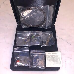 Southwestern Sterling Silver Leather Choker

set of 5 charm rings on a